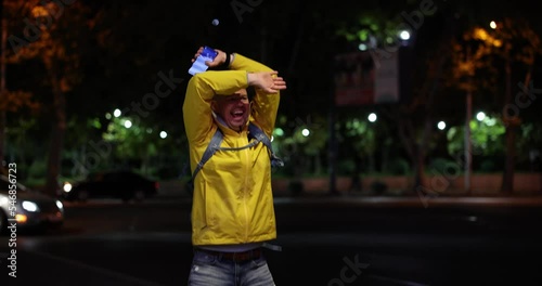 Pleased on man waving hands when meeting friend on street 4k movie slow motion  photo