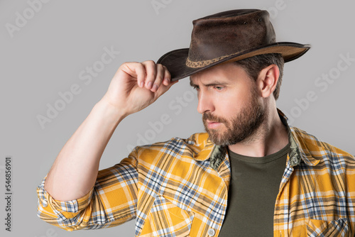 west man with cowboy hat isolated on grey background. west man in cowboy hat in studio.