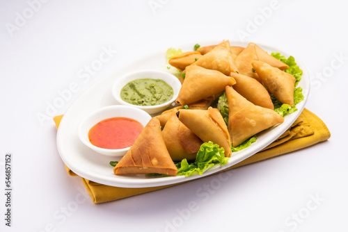 cocktail mini triangle samosa made using patti or strip, popular home made snack from India