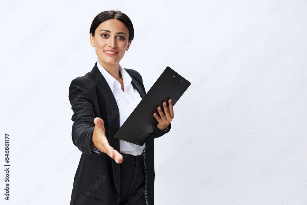 Business woman folder with documents in black business suit shows signals gestures and emotions on white background, freelancer job online time management Business woman folder with documents in black business suit shows signals gestures and emotions on white background, freelancer job online time management