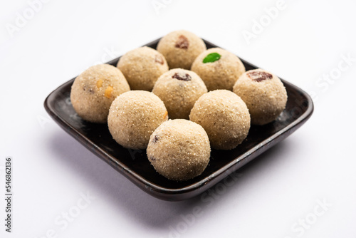 Rava Laddu or sooji ladoo is an Indian Sweet made with semolina, sugar, ghee, cashews and raisins photo