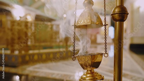 Smoke from a copper censer in a church