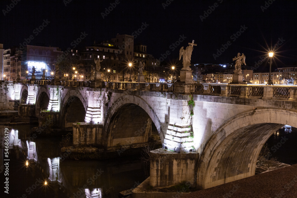 Rome, Italy, the bridge in the night city is beautifully illuminated.