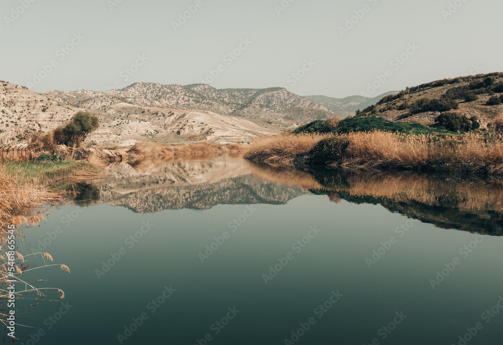 beautiful landscape of a large lake in the mountains with reflection. beautiful landscape of a large lake in the mountains with reflection.