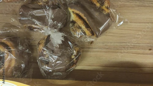 A cockroach crawls on a bread counter in a grocery store
