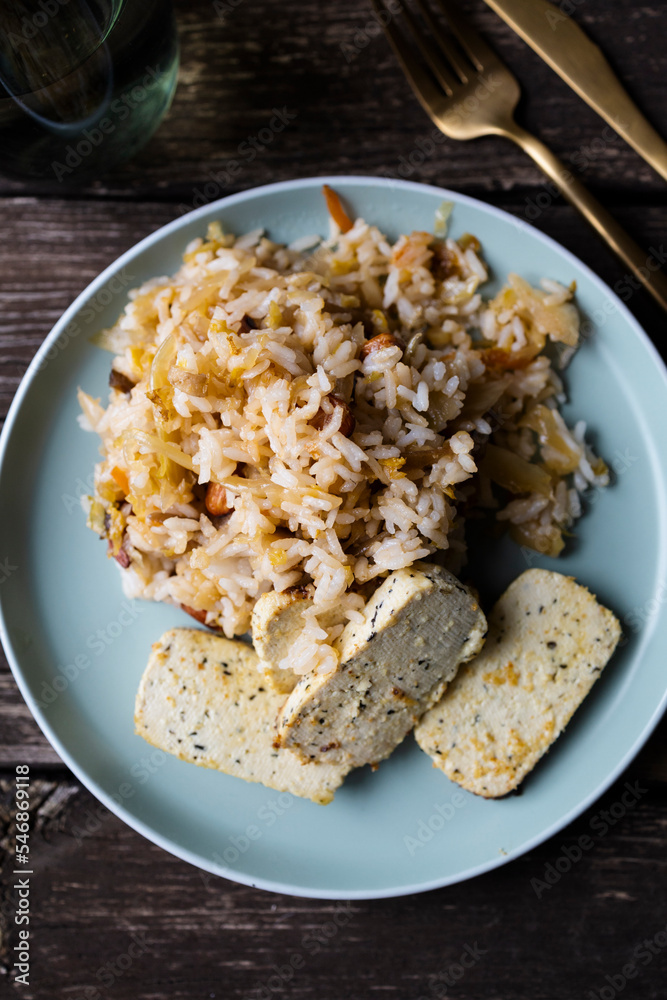 Kimchi with rice and tofu. Kimchi, traditional Korean side dish of salted and fermented vegetables. Kimchi with rice and tofu. Kimchi, traditional Korean side dish of salted and fermented vegetables.