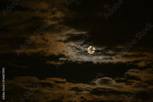 moon behind the clouds