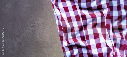 red and white checkered tablecloth with dark gray background
