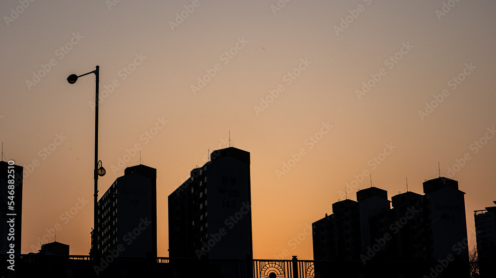 The sunset between buildings