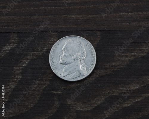 American coin five cents on wooden table photo