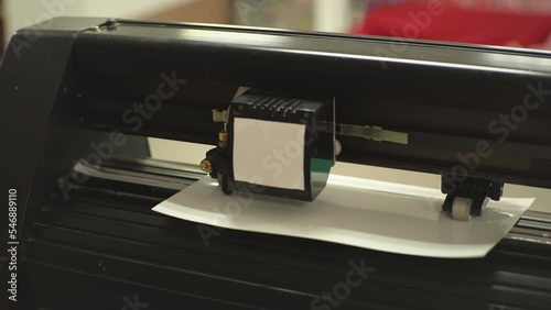 Cutting plotter with white paper. High-quality shooting in 4k format photo