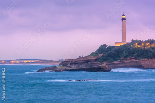 Scenic view of lighthouse against storm clouds in evening at Biarritz, France