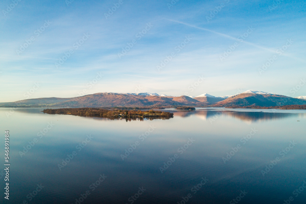 Loch Lomond With Scottish Landscape Reflected in the Calm Waters