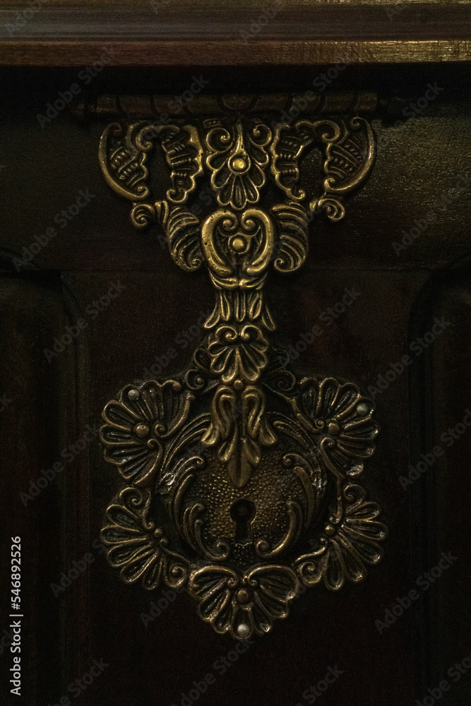 Fototapeta premium Antient metal lock on an old wooden chest