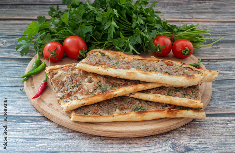 Traditional delicious Turkish food, pide with minced meat (Turkish name; kiymali pide) Traditional delicious Turkish food, pide with minced meat (Turkish name; kiymali pide)