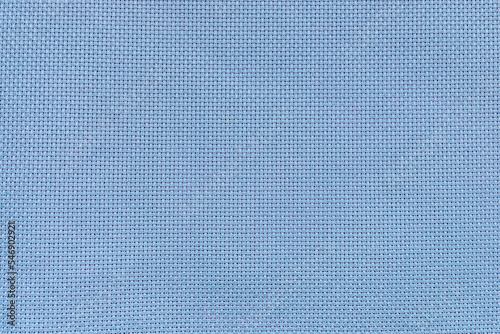 Blue canvas texture close-up. Fabric for embroidery. Cross-stitch.