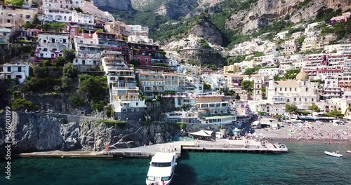 Panorama view of Amalfi Coast, Postitano, Italy. Aerial view of old town port, harbor scenic mountainous view. Ferry transports floating in the water. Rocky coastline. Luxury yachts. Seafront. photo
