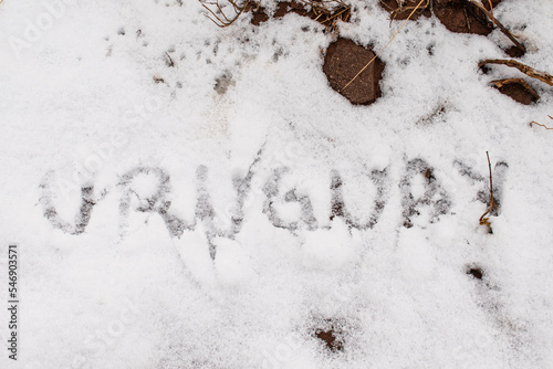 Word Uruguay written in the snow
