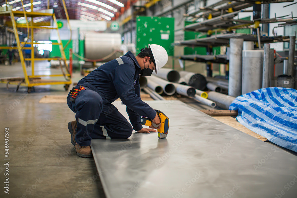 Male worker inspecting surface on plate stainless Male worker inspecting surface on plate stainless