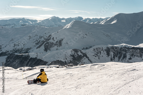 snowboarder have rest on slope, ski and snowboarding at winter mountain on track