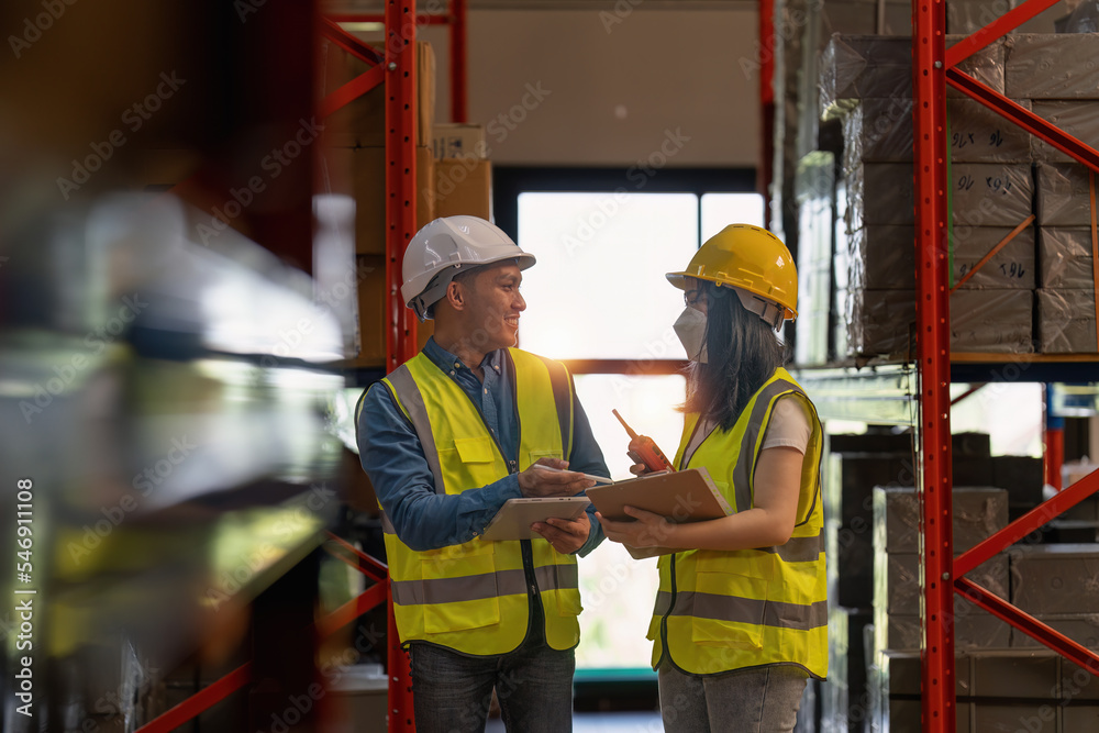 Working at warehouse. Male warehouse worker checking in storage department. Employee organizing goods distribution to the market. Working at warehouse. Male warehouse worker checking in storage department. Employee organizing goods distribution to the market.
