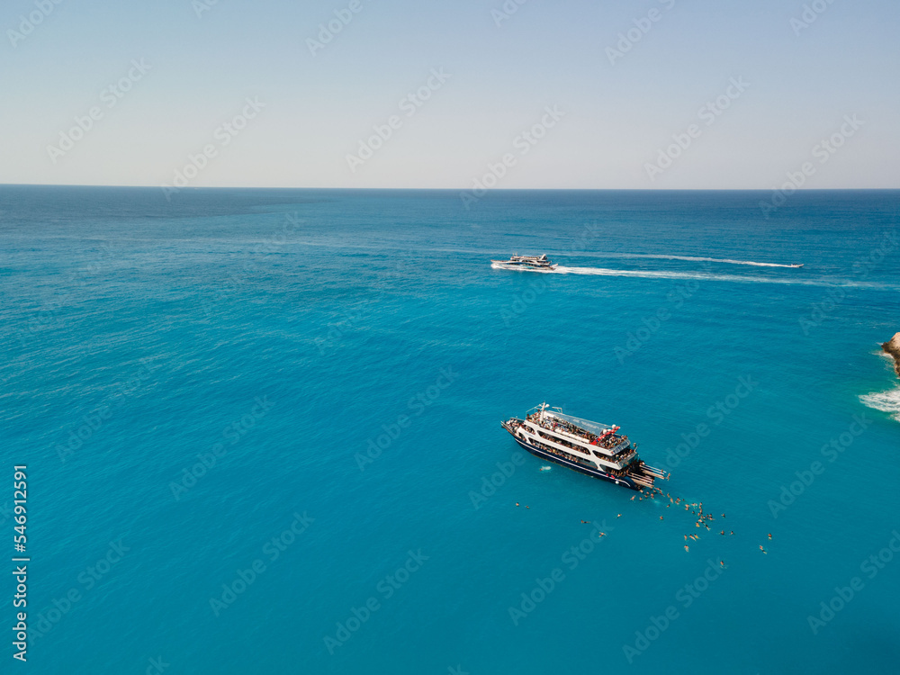 aerial view of porto katsiki beach with cruise boat people having fun aerial view of porto katsiki beach with cruise boat people having fun