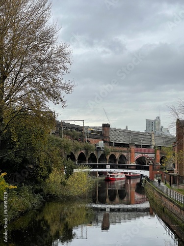 River view with buildings and bridges. Castlefield Manchester England.  photo