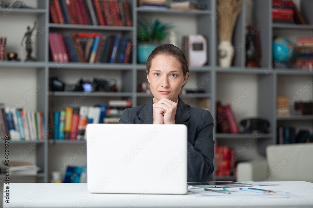 Fototapeta premium Business woman working in office. Watching webinar. Online consultant concept.