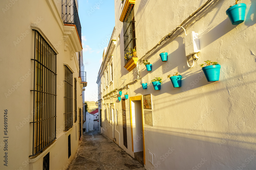 Narrow alley of white houses in a typical village of Andalucia, Arcos de la Frontera, Cadiz.