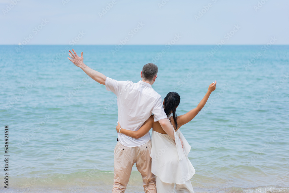 Romantic lovers young couple relaxing together on the tropical beach.Couple lover enjoy life.Summer vacations Romantic lovers young couple relaxing together on the tropical beach.Couple lover enjoy life.Summer vacations