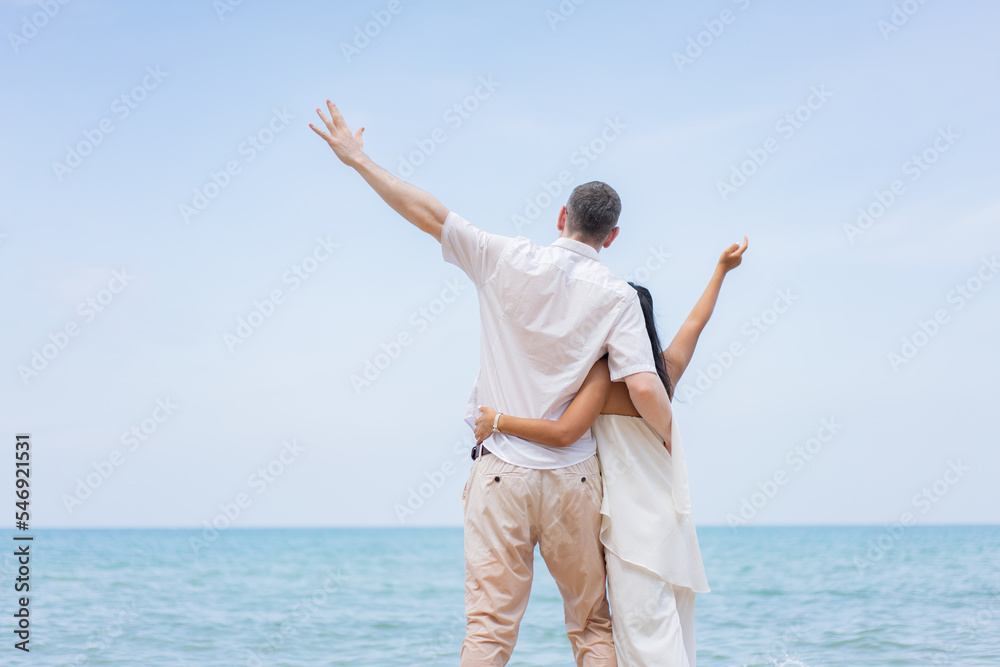 Romantic lovers young couple relaxing together on the tropical beach.Couple lover enjoy life.Summer vacations Romantic lovers young couple relaxing together on the tropical beach.Couple lover enjoy life.Summer vacations