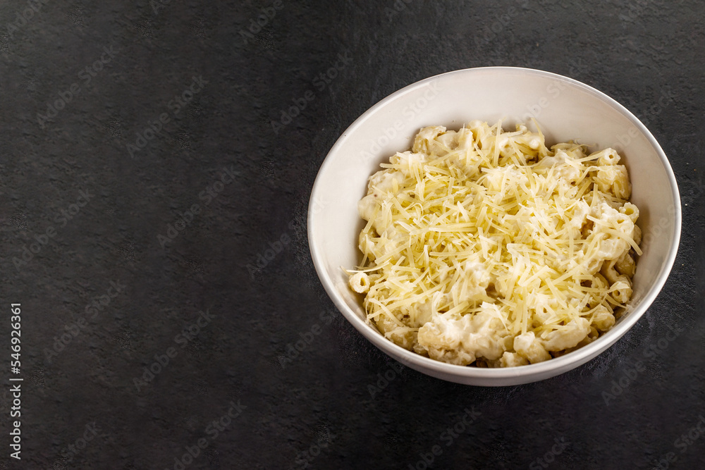 Mac and cheese. Traditional american fast food. Pasta with sauce from chedder parmesan mozarella and other cheese. Mac and cheese. Traditional american fast food. Pasta with sauce from chedder parmesan mozarella and other cheese.