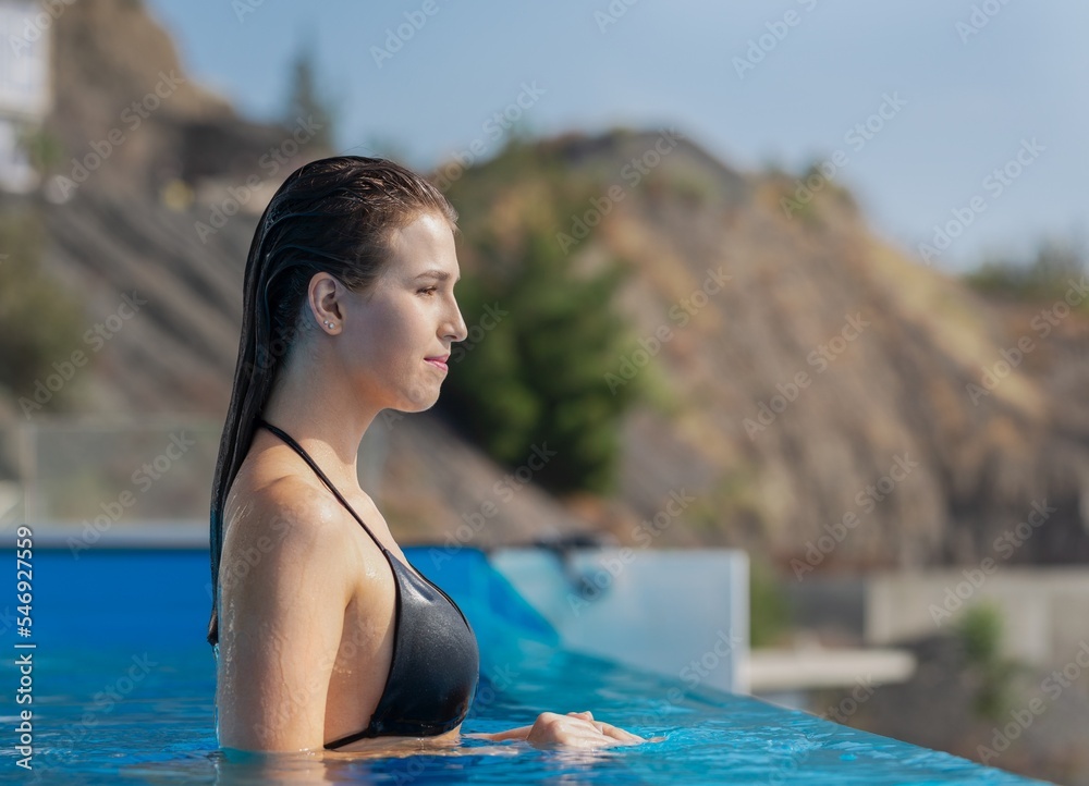 Beautiful girl in bikini holiday in the swimming pool