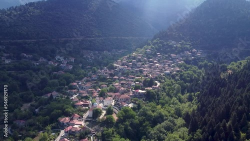 Areal drone footage from Karpenisi area, into the mountains and lake.