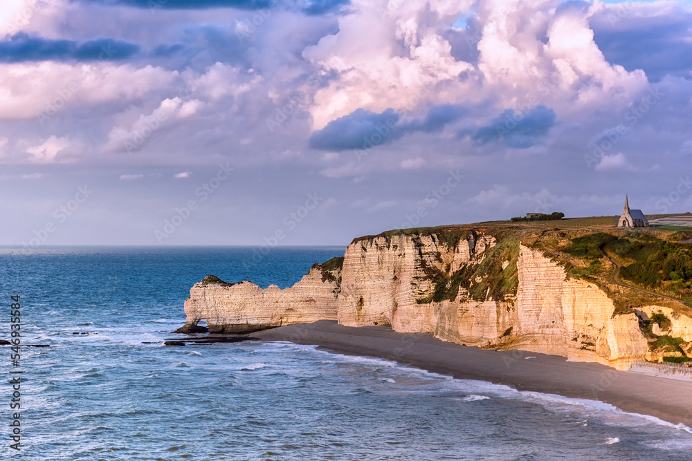 Scenic view of Etretat cliffs against cloudy sky in Normandy, France