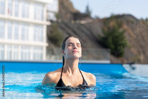 Beautiful girl in bikini holiday in the swimming pool © BillionPhotos.com