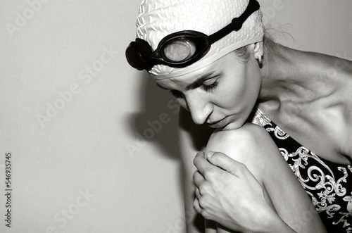 Portrait of young woman in swim hat photo