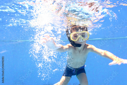 boy swimming in pool