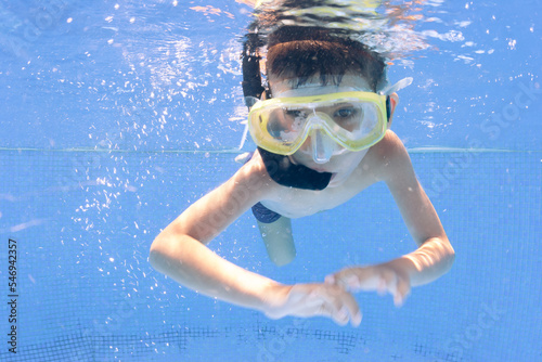 boy swimming in pool