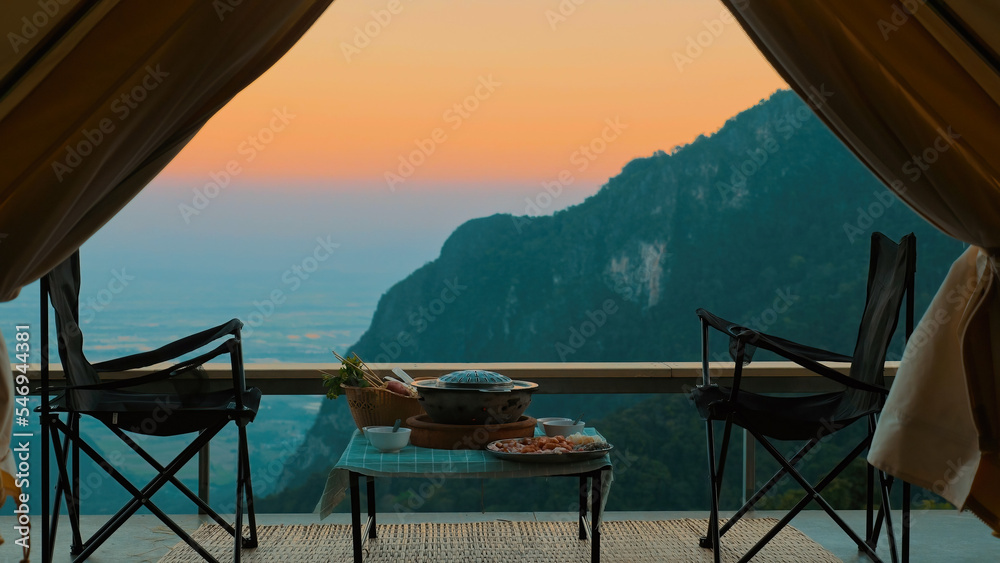 Fototapeta premium View from inside camp tent. Amazing sunset time in mountains