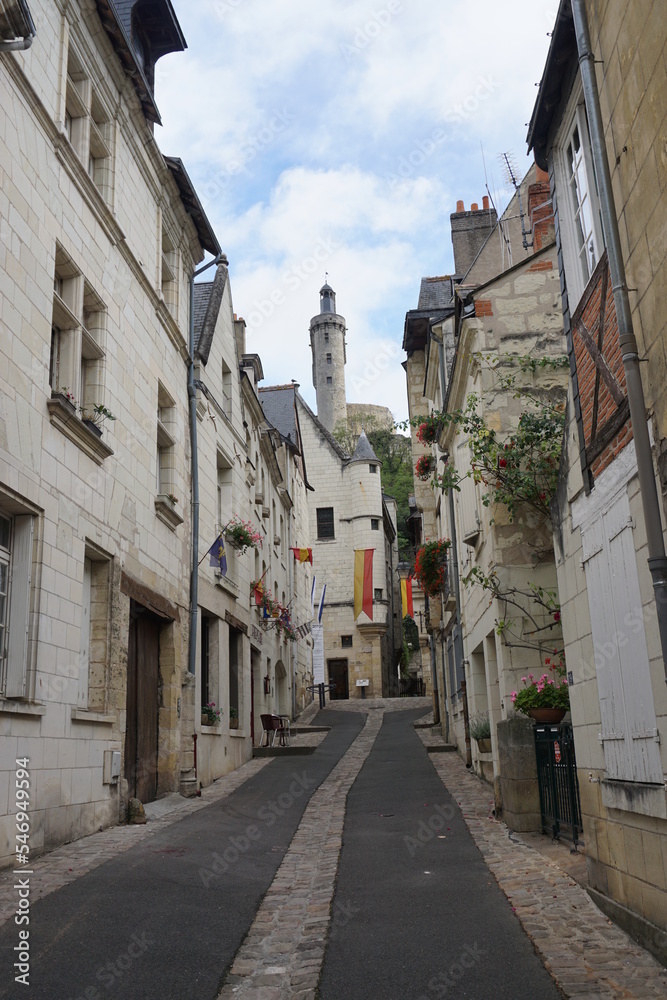 narrow street in the old town of Chinon France under the stone castle