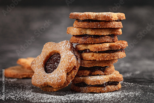 Linzer Christmas cookies. Pyramid biscuits with plum jam. Homemade pastries