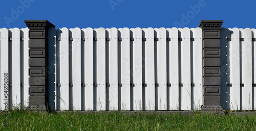 white wooden fence with granite posts