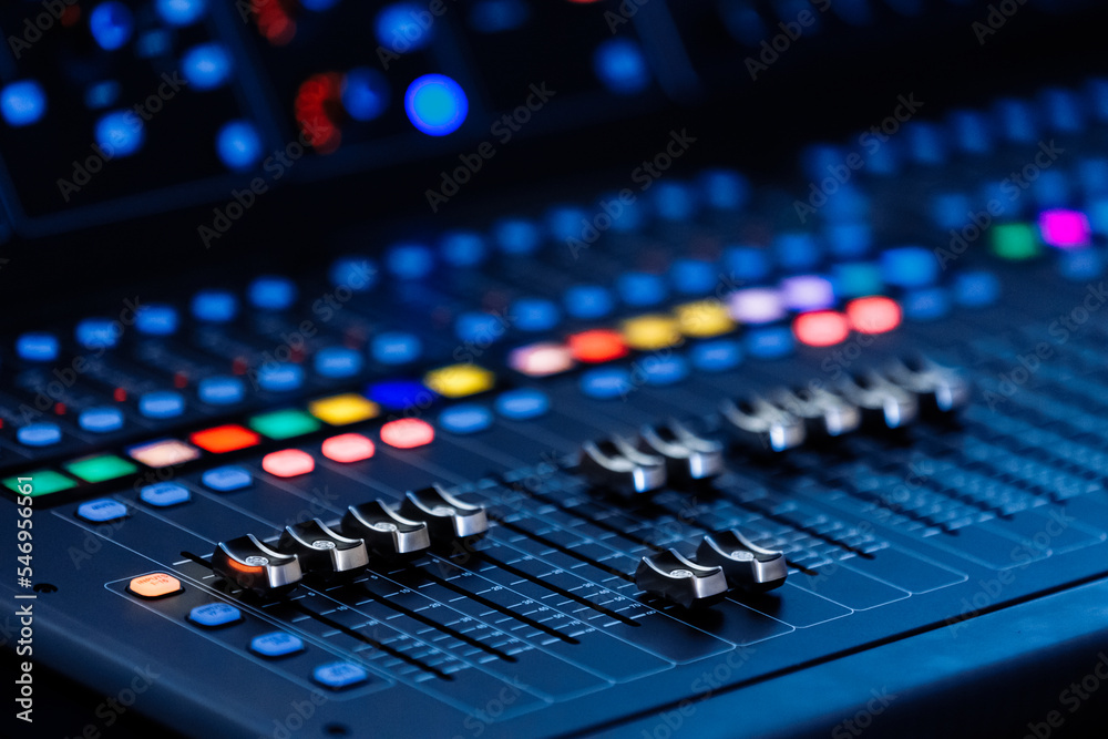 Concert sound mixer panel with volume regulators. Professional audio and light equipment for sound recording studio, live music broadcasting, television, party. mixing console. audio signals