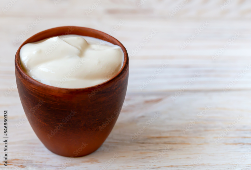 Fresh sour cream in a bowl Fresh sour cream in a bowl