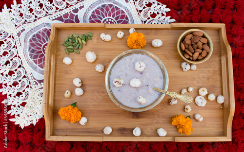 Makhana Kheer made with Crispy Lotus pops Seeds or Phool Makhana or Fox Nuts, milk and jaggery or sugar in copper bowl. Very popular sweet dish or food of any vrat or fast during festival in India.