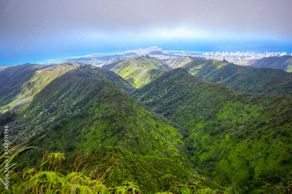 panorama of the hawaiian island of oahu and honolulu as seen from the top of the wiliwilinui ridge trail, hiking in the hawaiian mountains, the amazing landscape of oahu