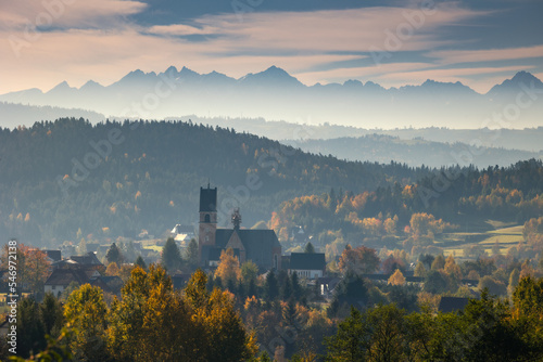 Highway towards the Tatra Mountains in autumn scenery with a view of the highest peaks in Poland. © PawelUchorczak
