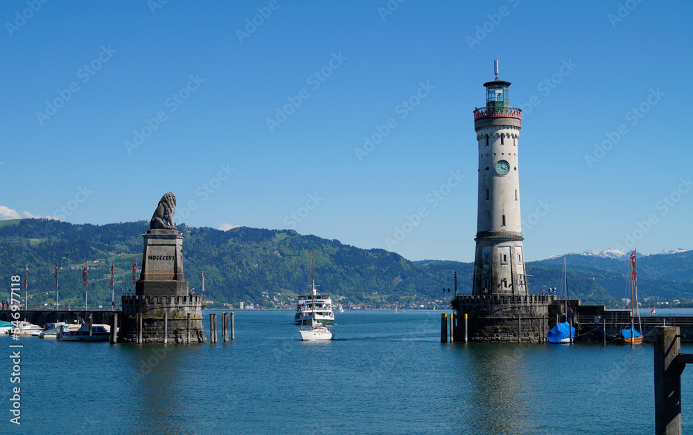 the beautiful harbour of Lindau island on lake Constance (Bodensee) with the Alps in the background, Germany on fine sunny spring day