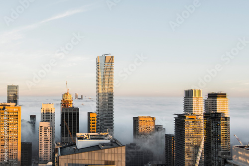 Toronto city skyline above fog